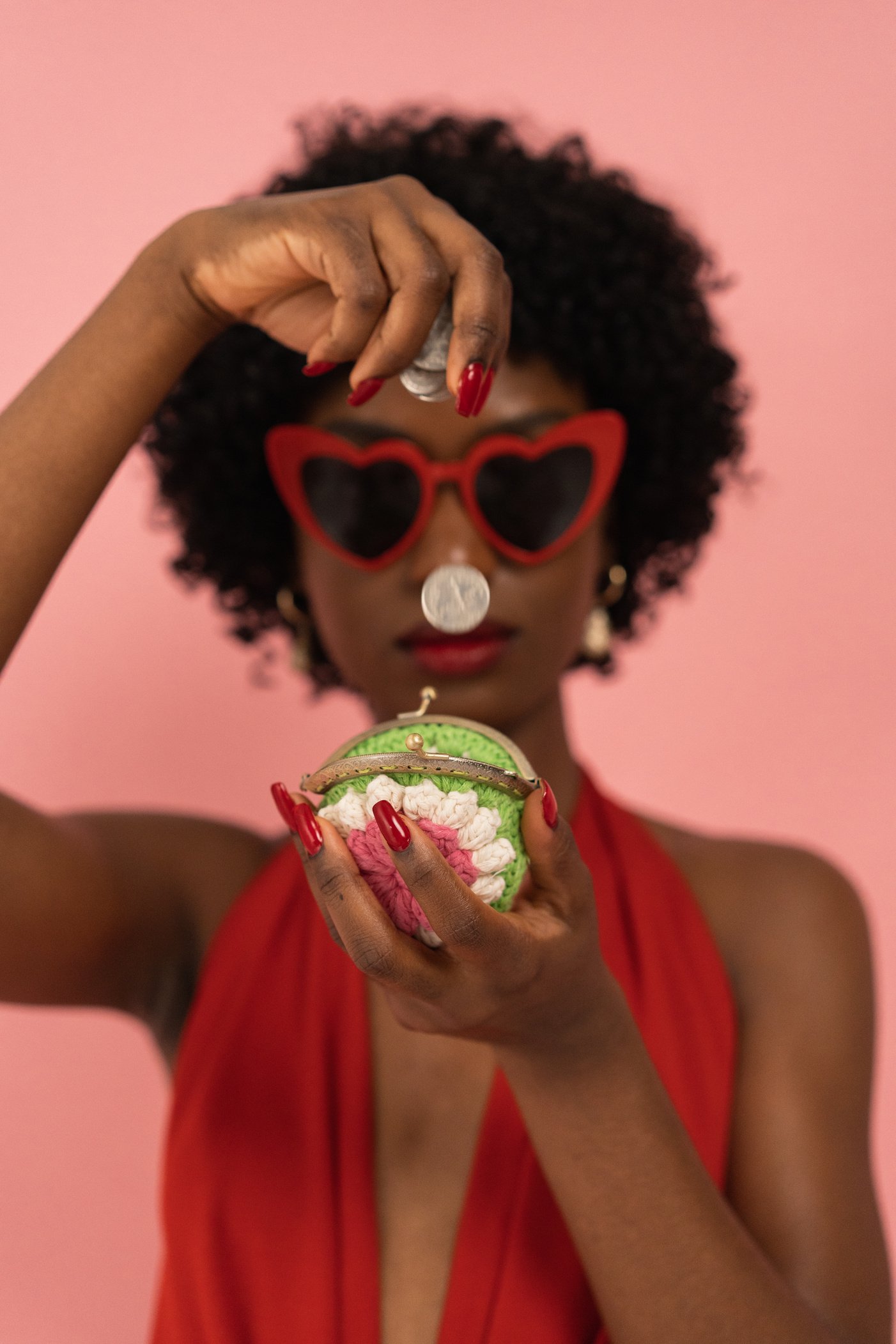 Stylish Woman Dropping Coins in a Purse