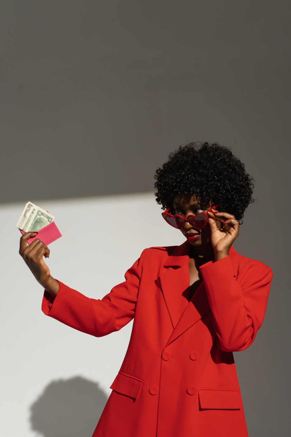 Stylish Woman Looking at Money on Her Hands